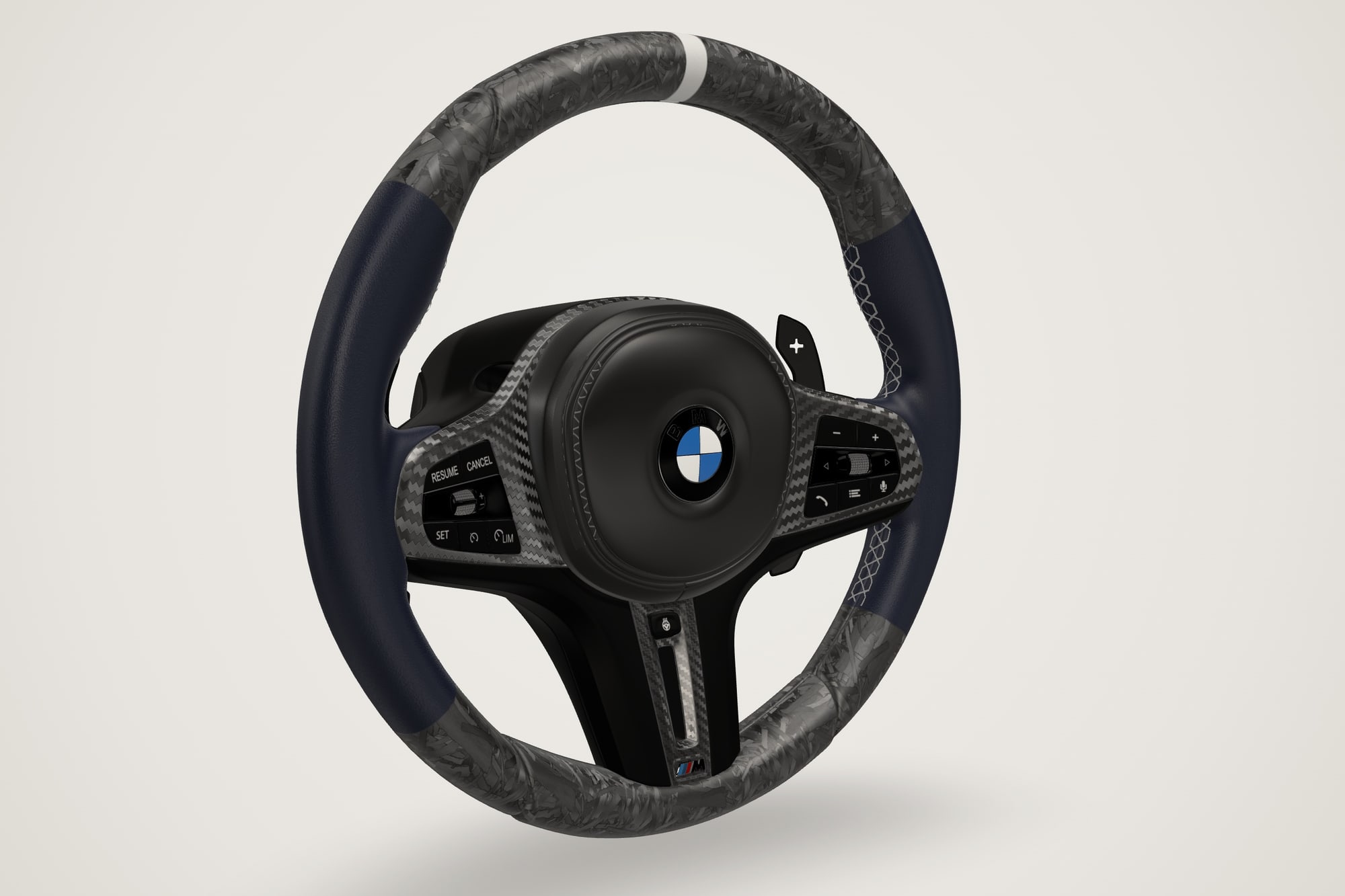 BMW M wheel in navy Nappa with matte forged carbon and light grey stitching